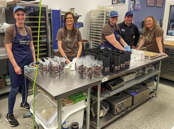 Emily Rosiek, Sarah Conrad, Jessica Hardy, David and Shana Sicotte make chocolate treats at the Great Lake Chocolate &amp; Dessert Co. in Traverse City. Enterprise photo by Brian Freiberger