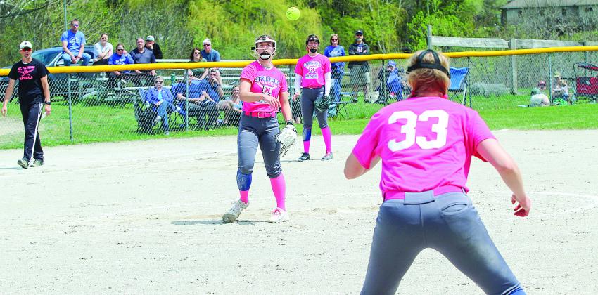 St. Mary junior Cathryn Mikowski handles a ground ball and delivers a strike to first baseman Leah Fleis during the Kris Popp tournament Saturday.