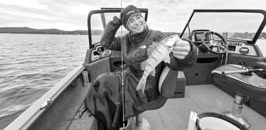 Emilee Ballant, a senior at Michigan State, enjoyed Christmas Day on Glen Lake with a bucketful of perch. Courtesy photo