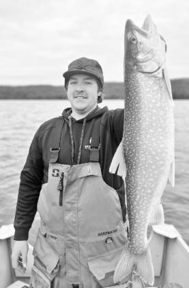 Beau Harriger, upon hearing that perch were biting, boated a big lake trout from Glen Lake on the day after Christmas. Courtesy photo