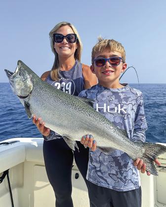 A big fish brought big smiles to two fishers aboard the “Maevelous,” which is skippered by David Tropf. Courtesy photo