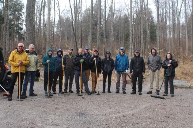 Several volunteers brave the rain on Tuesday to clean up Palmer Woods Trail in one of several events celebrating Earth Week across Leelanau County. Enterprise photo by Brian Freiberger