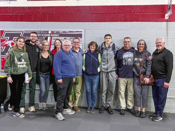 Lake Superior State University senior Xander Okerlund with his family after a tournament game in Indiana. From far left: sister-in-law Korolina and brother Oscar Okerlund, aunt Amy, cousin Maggie, uncle Mark, uncle Matt, aunt Cindy, father Scott, mother Melissa, and uncle Jon. Courtesy photo