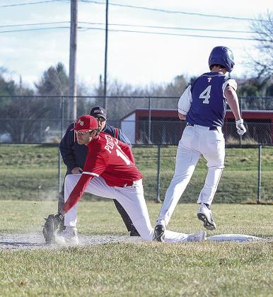 In an opening day double-header, Lake Leelanau St. Mary defeated Suttons Bay 4-2, 10-9 in a pair of thrilling baseball games on Tuesday. Suttons Bay senior first baseman Tyler Porter earns the out with an acrobatic catch.