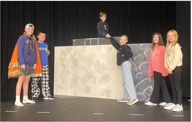 Third grader Lome Withers is playing Oz in the musical and is seen atop a platform (at center) during Monday’s rehearsals. Other leading characters pictured are Dorothy, Toto, Lion, Scarecrow, and Tinman. Photo courtesy of Sarah Shutler