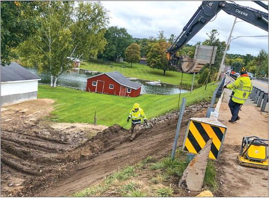 The bank of the M-204 bridge, which was reconstructed in 2020, gave way to more than seven inches of rain that fell over a six- to eight-hour period last week. Enterprise photo by Alan Campbell
