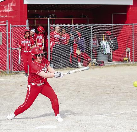 Suttons Bay senior Minnie Bardenhagen makes contact during her first softball game against Lake Leelanau St. Mary on Tuesday. Enterprise photo by Brian Freiberger