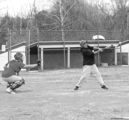 Suttons Bay’s Anthony Oskaboose batting (right) and catcher Gavin Schichtel (left) practice during spring ball on Monday. Enterprise photo by Brian Freiberger