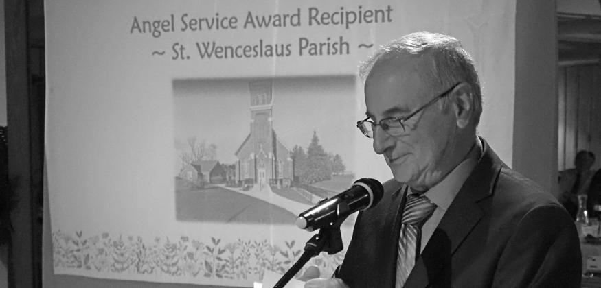 Deacon Martin Korson accepts the Angel Service Award representing St. Wenceslaus Parish. Courtesy photo