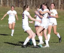 The Leland Comets celebrate after senior Olive Ryder scores with a 30-yard shot. Enterprise photos by Brian Freiberger
