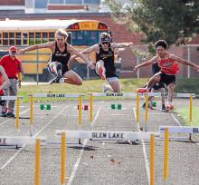 Glen Lake, Leland, and Benzie Central 300-meter hurdlers compete during the first track meet of the season. From left to right Caden Sheehan, Jimmy Alpi and Joseph Abeyta. Photo courtesy of Bob Alpi