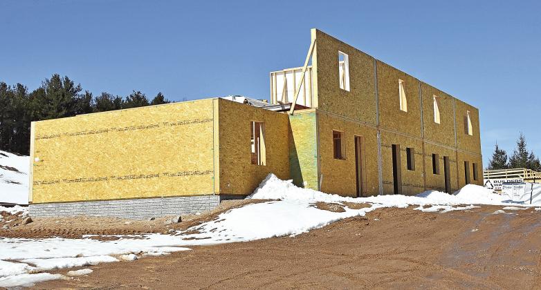 Construction of eight affordable rental units in the Vineyard View Apartments complex in Suttons Bay Township is expected to be complete in the fall. Enterprise photo by Eric Carlson