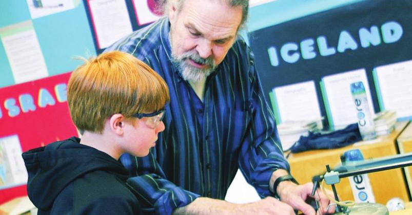 Artist Tom Woodruff is seen recently teaching a student at Goodwillie Environmental School in Ada, Michigan. Photo courtesy of Lydia Woodruff
