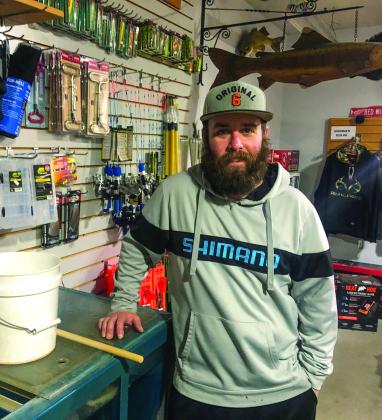 With ice fishing non-existent on county inland lakes due to warm weather, Greg Alsip is pondering whether to open his bait shop next winter or stay open for only three seasons. He’s out of minnows now and does not plan to restock until spring fishing begins. Enterprise photo by Alan Campbell