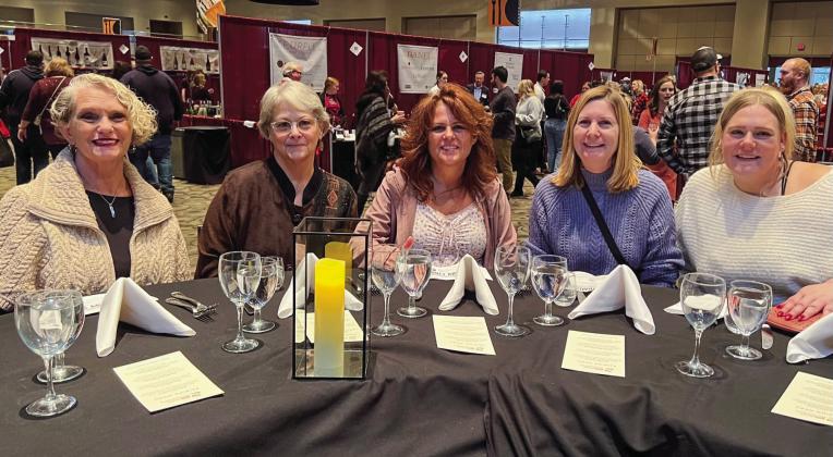 Omena resident Georgienne Hammer attended the International Wine, Beer, and Food Festival in Grand Rapids with four of her friends. Pictured at a pairing dinner were from left Nancy Weir, Hammer, Diane Minciotti, Mary Swidwa, and Macie Swidwa. Photo courtesy of Georgienne Hammer
