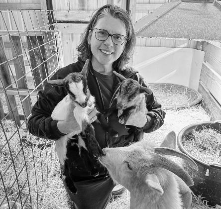 Linda Oosse is pictured with “Princess” the goat and her babies at the barn. Courtesy photo