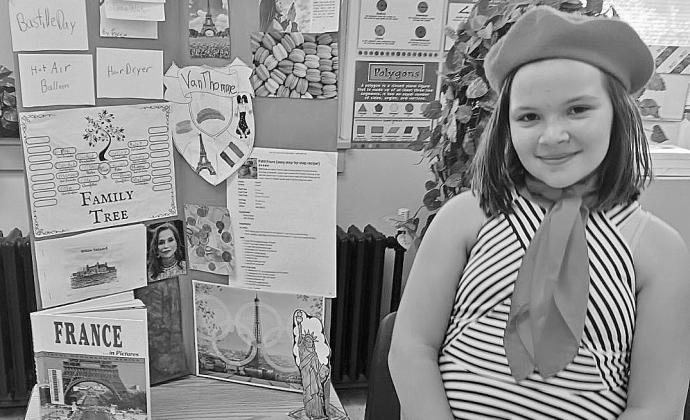 St. Mary fourth grader Aubrey VanThomme researched her family history and culture as part of the school’s annual Ancestry Day last week. She chose France in honor of her family history, researching it and reporting her findings through interactive displays. Students create a family tree, learn about the native language, dress, food, religion and currency. Courtesy photo