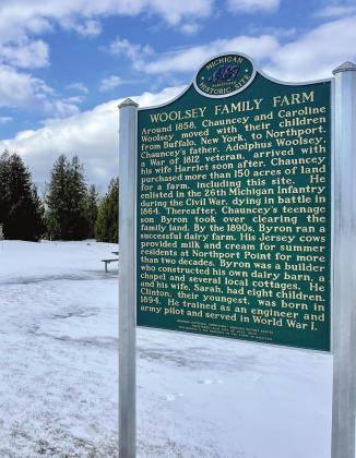 A Michigan historical marker was put up on July 14, 2021 highlighting the Woolsey Family Farm and airport as a registered historic site. The marker captures the story of how the Woolsey family settled in Northport, while also recognizing the signifi cance of the airport and what it stands for. Enterprise photo by Meakalia Previch-Liu