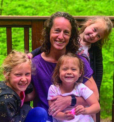 A day at the beach with her children inspired Brittany Darga to write a book about Petoskey stones. She is pictured here with daughters Abigail, 8, and twins, Morgan and Anna, 5. Courtesy photo