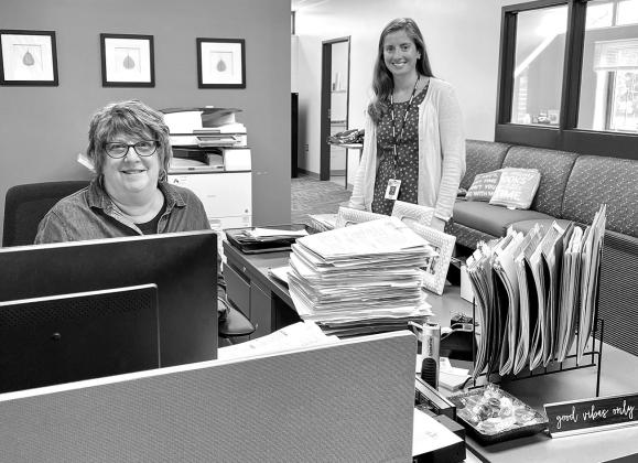 Lisa Stark (at left), virtual school administrative assistant, and Ashley Shimek, middle and virtual school principal, are seen in their new office space in the Suttons Bay middle school building. Enterprise photo by Meakalia Previch-Liu