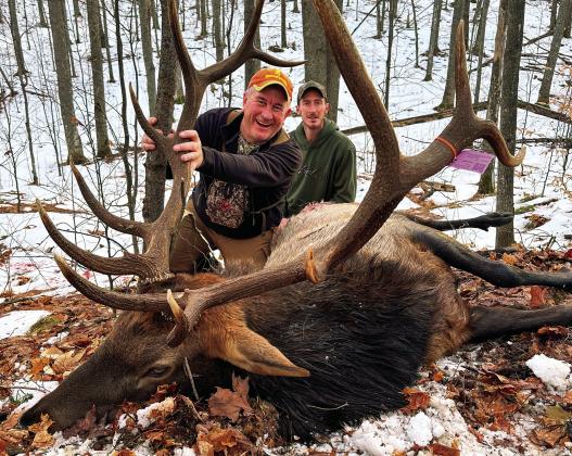Roger Schaub, left, stalked elk with guide James Bunker for six days before they caught up with this 700-pound trophy. Schaub’s gun went click, but the second shot worked. Courtesy photo