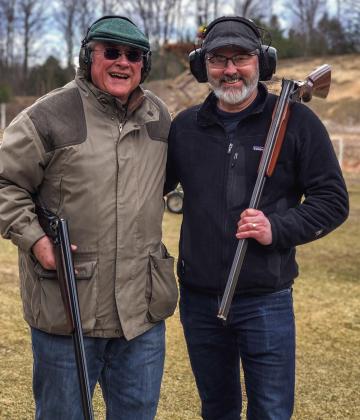 Gordie Shull, left, and Sean McDowell take a break after a round of shotgunning at opening day at Cedar Rod and Gun Club. Enterprise photo by Alan Campbell