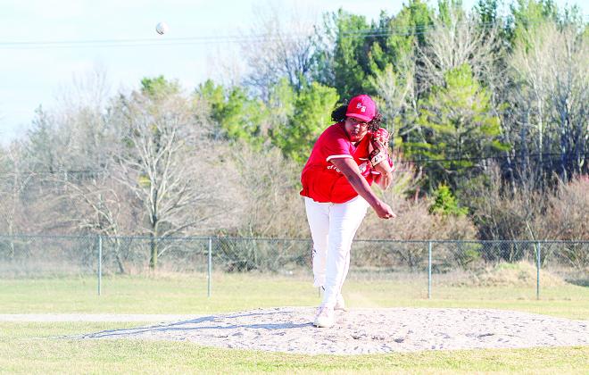 Suttons Bay pitcher Zachariah Raphael deals against Lake Leelanau St. Mary earlier this month.