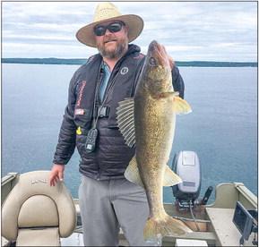 While walleyes are rarely targeted in West Grand Traverse Bay, some are boated including this 31-inch trophy taken by Aaron Sahs of Northport.