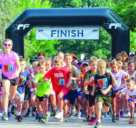 Kids take off for a half mile race during the Running Bear Run in Glen Arbor on Tuesday.