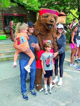The Tanjeloff family take a picture with the Running Bear Mascot on Tuesday. From left to right: Lilah, Eric, Liam and Colleen. Enterprise photos by Brian Freiberger